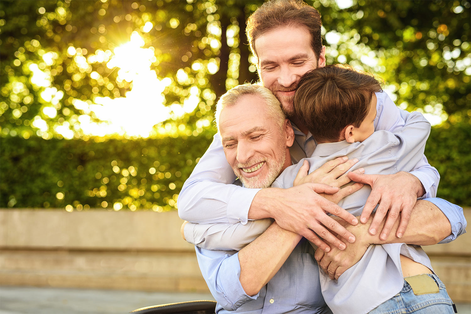 A caregiver embracing an elderly family member