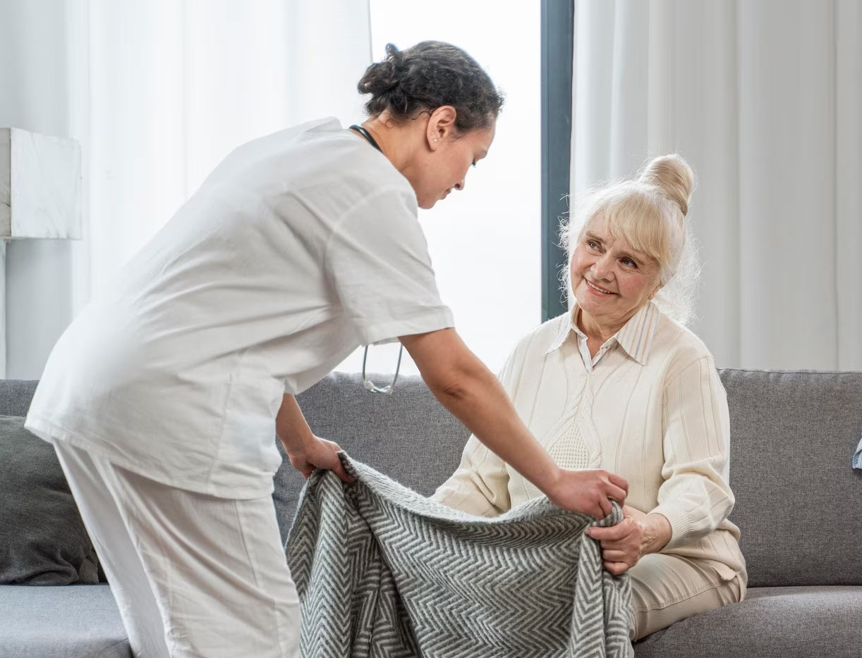 A nurse caring for a resident in a post-acute facility